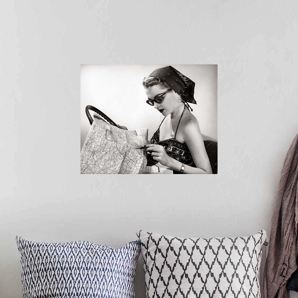 A bohemian room featuring 1950's Woman Wearing Bandana, Sunglasses, And Halter Top Marking Road Map