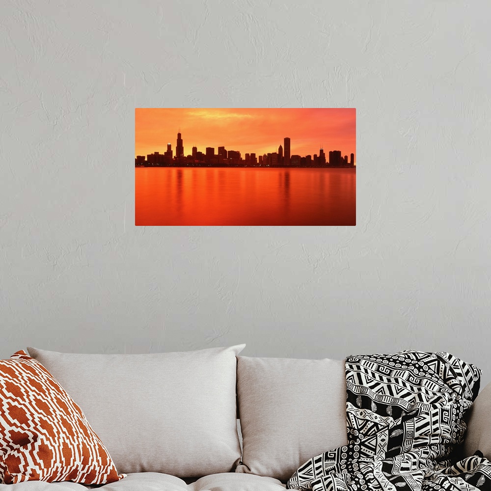 A bohemian room featuring Large panoramic photograph of the Chicago, Illinois (IL) waterfront at dusk with the sun's rays r...