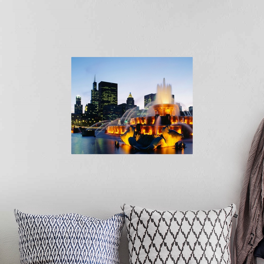 A bohemian room featuring Huge photograph taken of Buckingham Fountain lit up at night as it sprays water in an artful sequ...