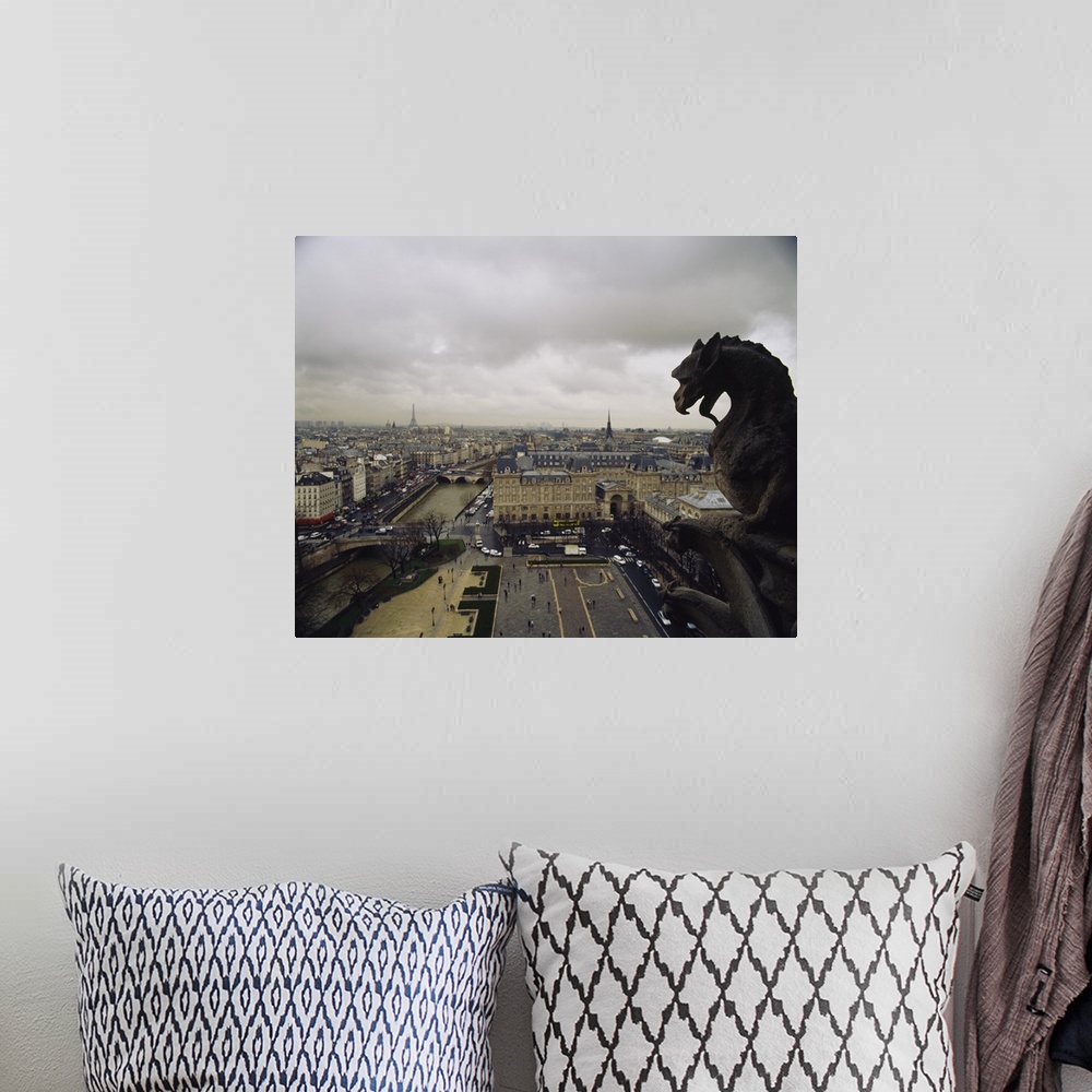 A bohemian room featuring Horizontal, high angle photograph on a big canvas, looking past a gargoyle from the top of Notre ...