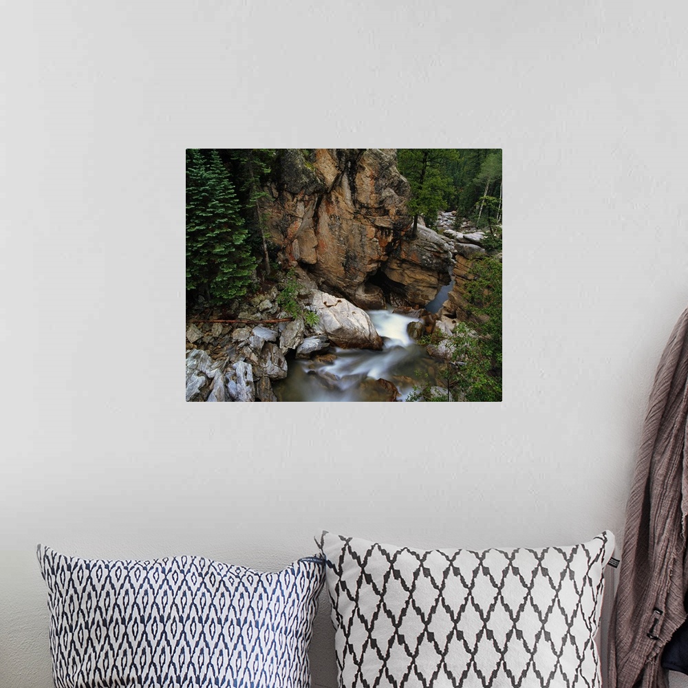 A bohemian room featuring Aerial photo of the mountains and forest surrounding the Roaring Fork River in White River Nation...