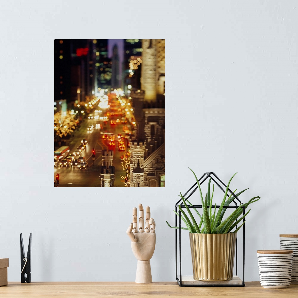 A bohemian room featuring Vertical panoramic photograph of busy street lined with tall buildings that are lit up in the nig...