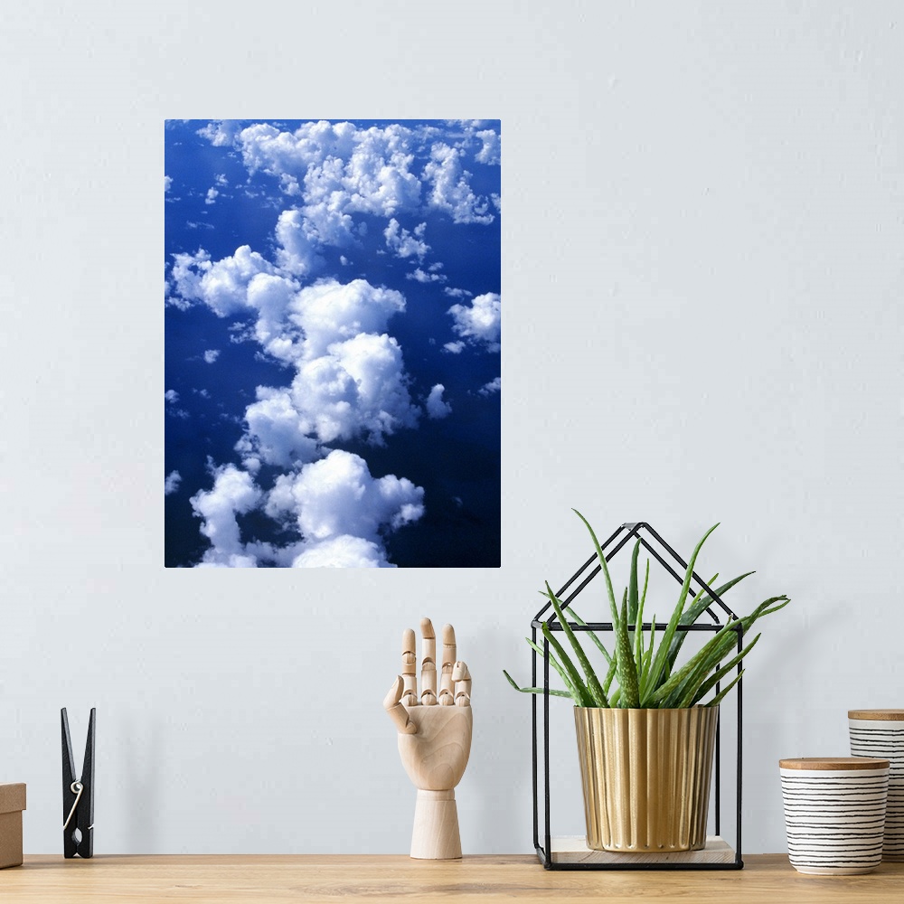 A bohemian room featuring Multiple white clouds, blue sky.