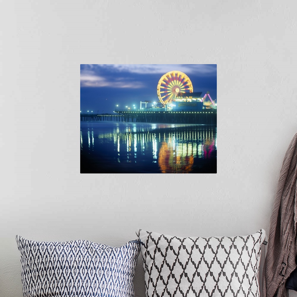 A bohemian room featuring Landscape, large photograph of Municipal Pier at night, reflecting in the waters in the foregroun...