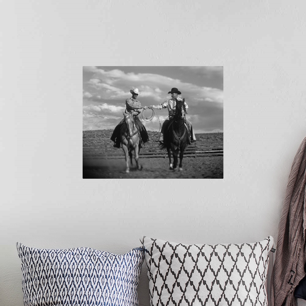 A bohemian room featuring Two Cowboys on Horseback