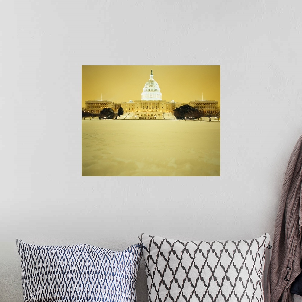 A bohemian room featuring US Capitol Building illuminated at night with snow, Washington DC