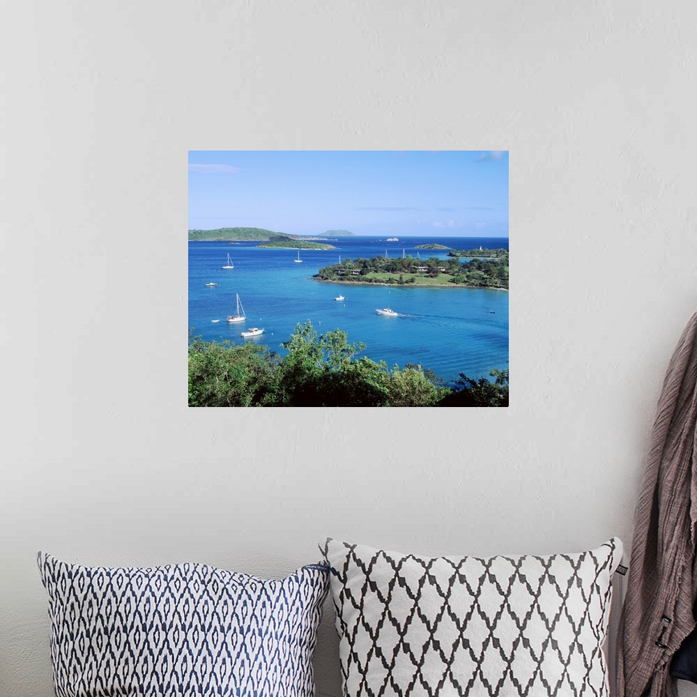 A bohemian room featuring Large photo on canvas of sail boats in a bay in the ocean.