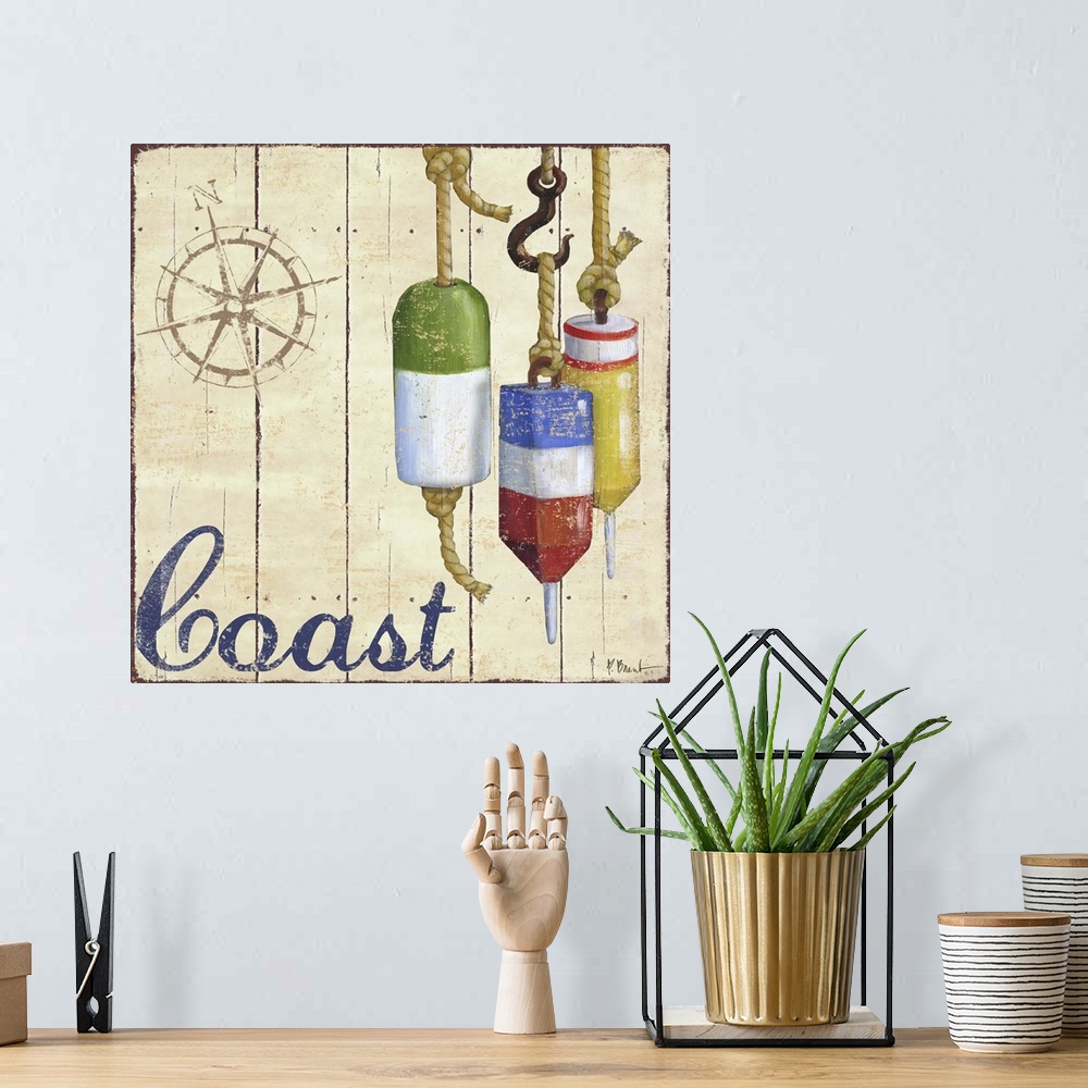 A bohemian room featuring Painted nautical sign on wood panels with a compass rose, buoys, and the word Coast.