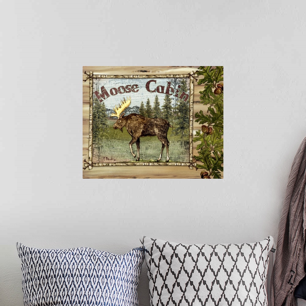 A bohemian room featuring Decorative artwork of a moose in a frame, with oak leaves, acorns, and the words Moose Cabin.