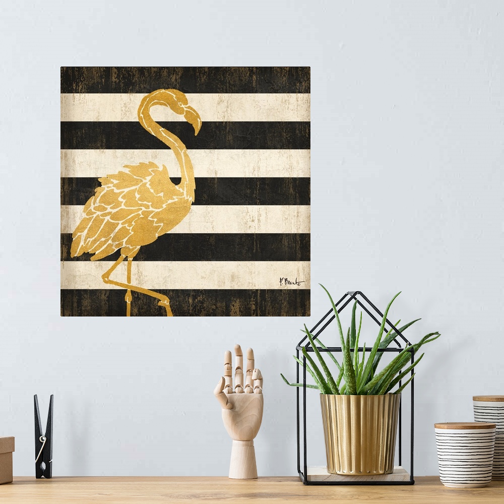 A bohemian room featuring Square decor with a metallic gold flamingo on a black and white striped background.