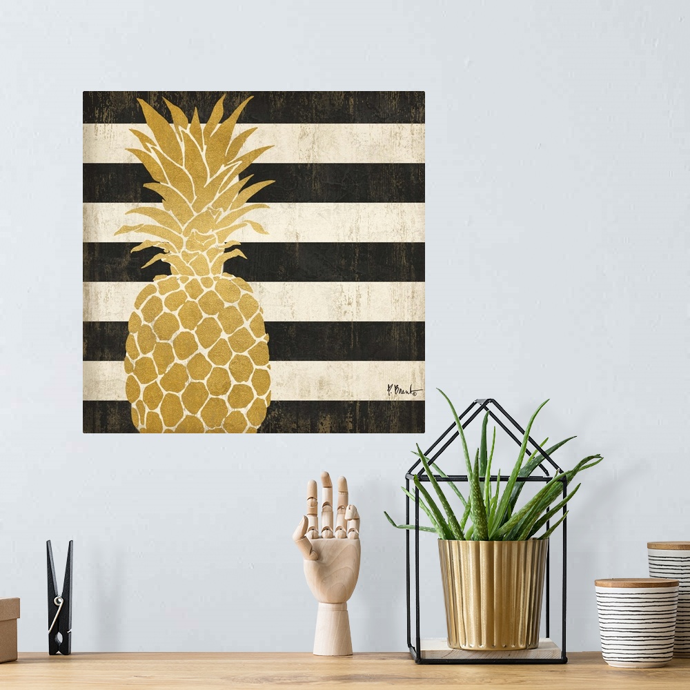A bohemian room featuring Square decor with a metallic gold pineapple on a black and white striped background.