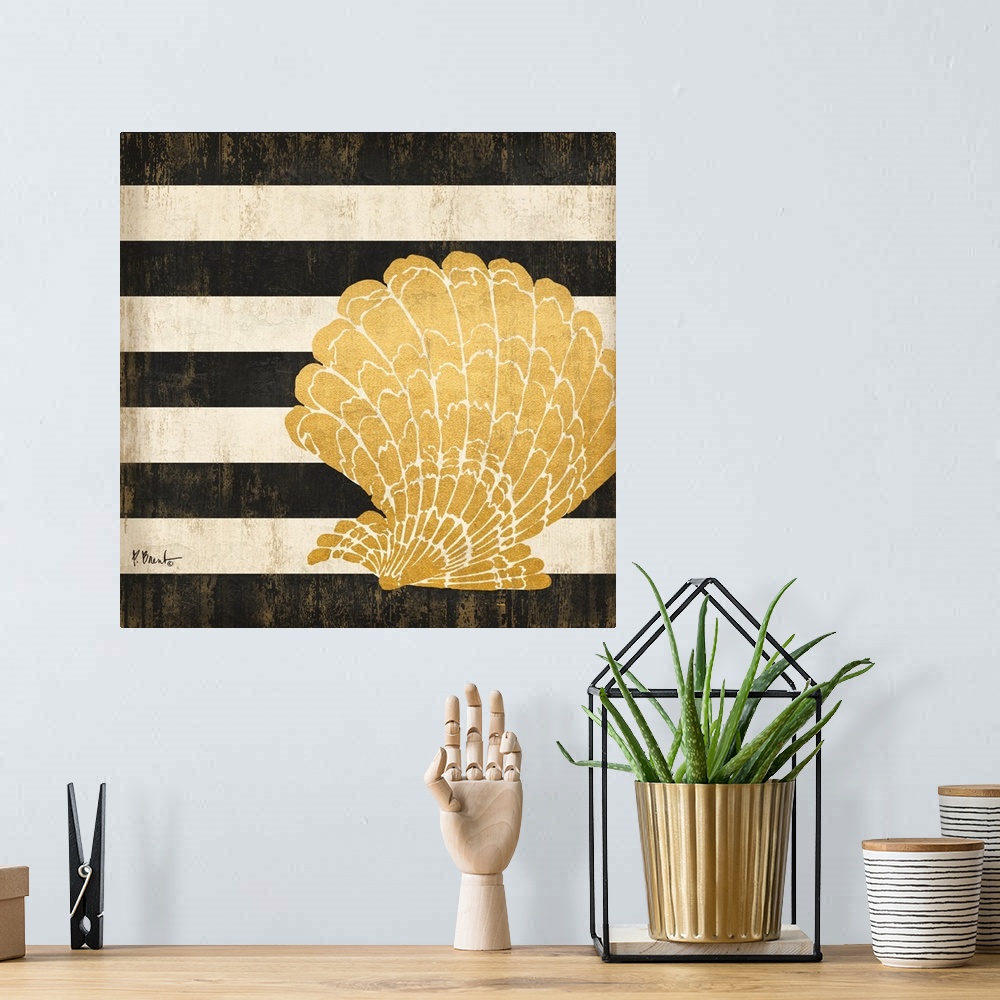 A bohemian room featuring Square decor with a metallic gold seashell on a black and white striped background.