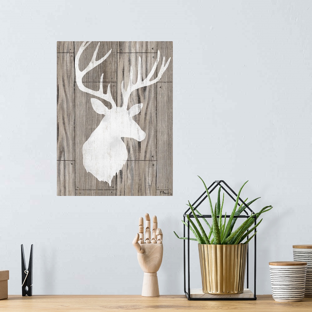 A bohemian room featuring Contemporary decorative artwork of a light deer silhouette on a textured wooden background.