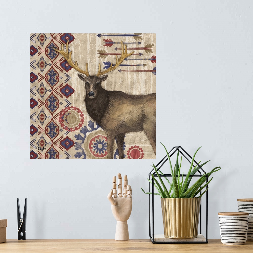 A bohemian room featuring Decorative artwork of an elk with folk patterns and arrows on a wood texture.