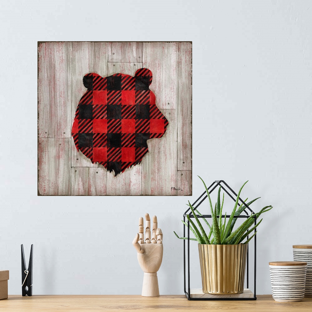 A bohemian room featuring Square cabin decor with a red and black flannel patterned silhouette of a bear on a faux distress...