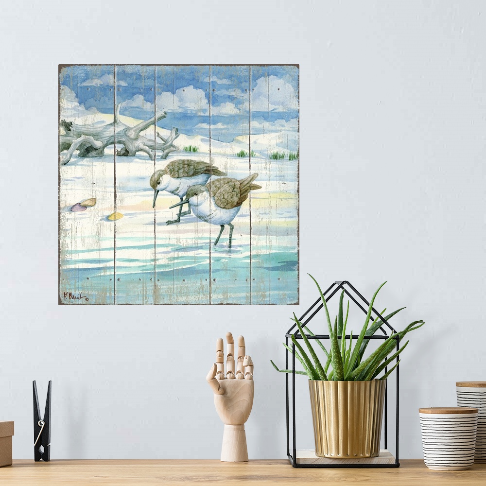 A bohemian room featuring Square painting on a faux wood background of two sandpipers grazing on the shore with driftwood i...