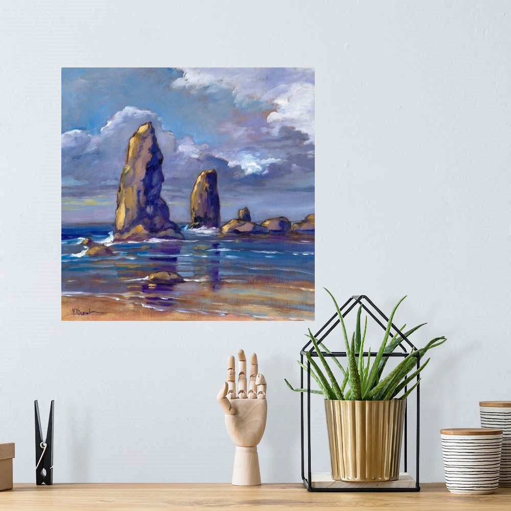 A bohemian room featuring Landscape painting of the tall rock landmarks on the Oregon coast.