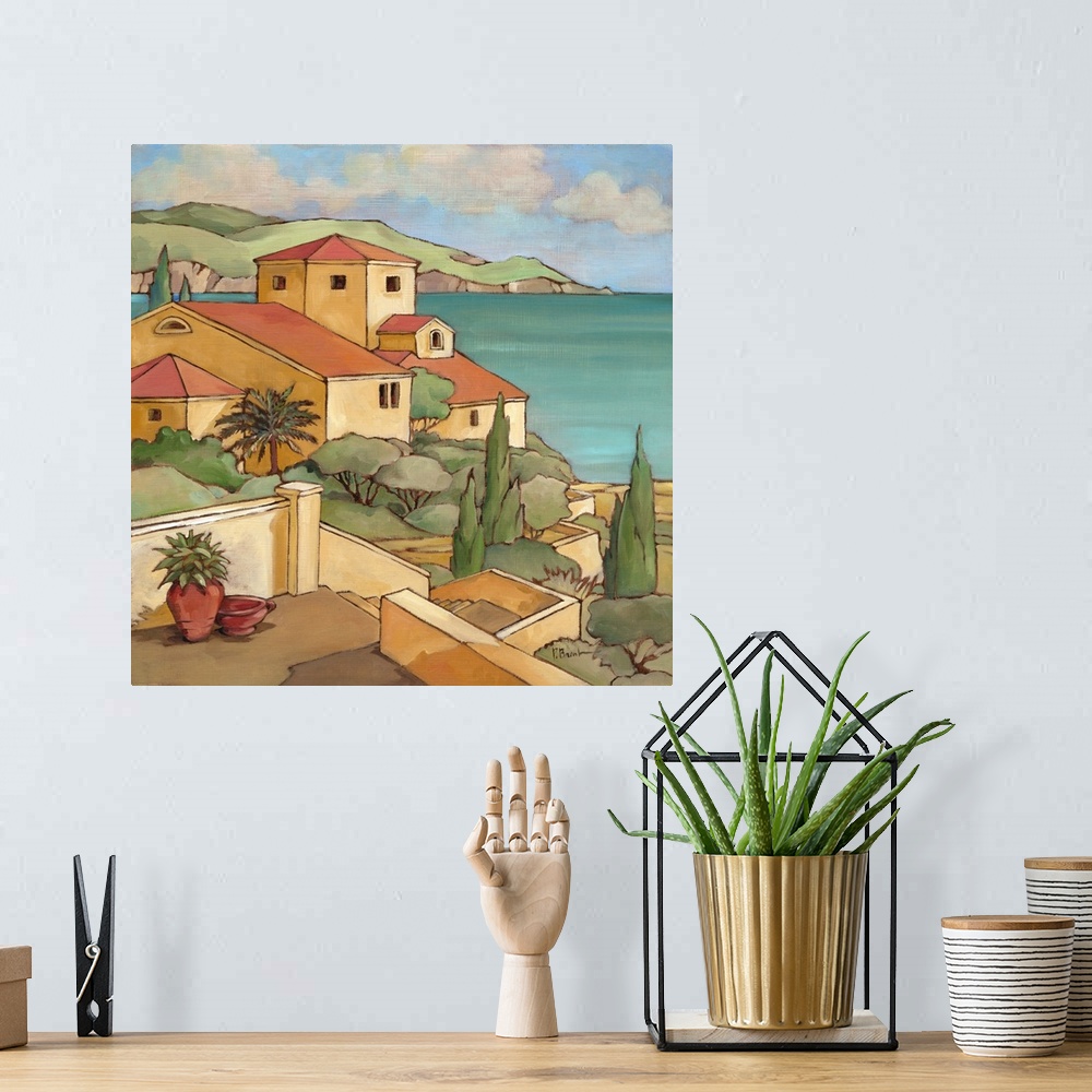 A bohemian room featuring Painting of a Mediterranean town overlooking the sea.