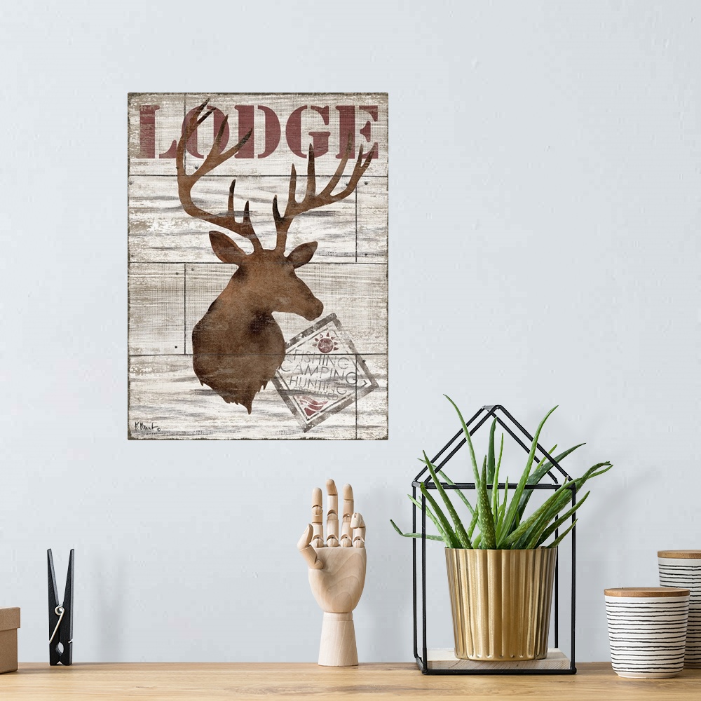 A bohemian room featuring Contemporary decorative artwork of a deer silhouette with the word "lodge" on a textured wooden b...