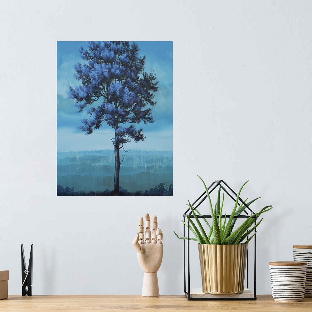 A bohemian room featuring Contemporary artwork of a tall tree in a field in shades of blue.