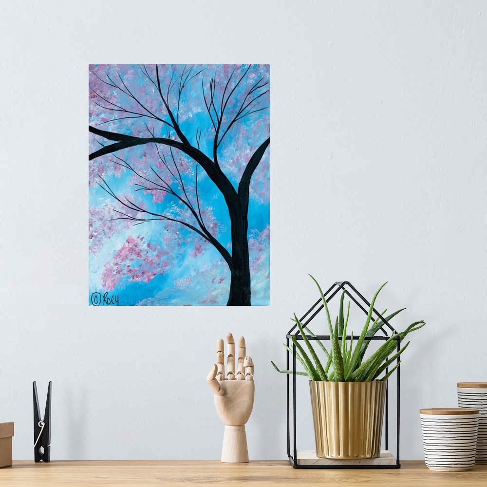 A bohemian room featuring Vertical contemporary painting of a Cherry Blossoms Tree surrounded by brilliant blue skies.