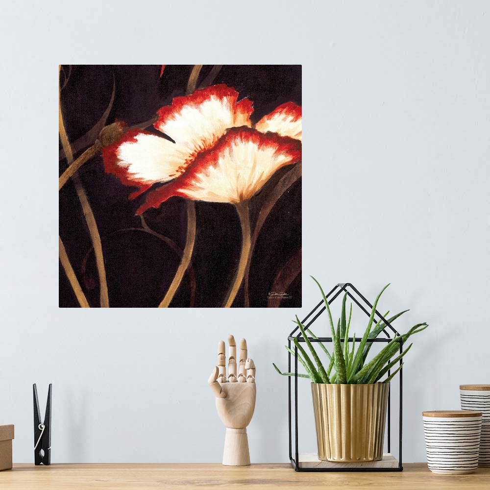 A bohemian room featuring Artwork of a red and white poppy with the stems in the background.