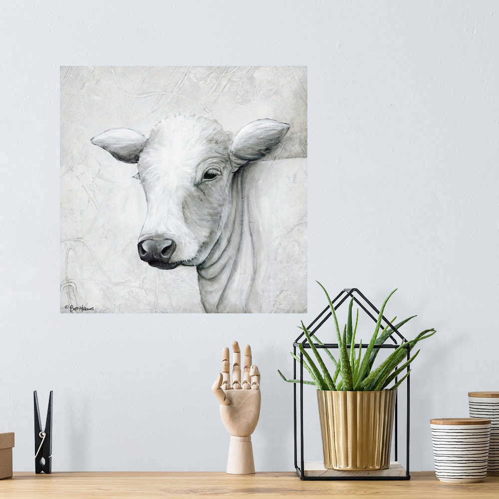 A bohemian room featuring Portrait of a white cow with long ears.
