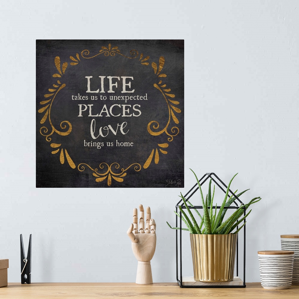 A bohemian room featuring Typography artwork about love with vintage flourish designs.