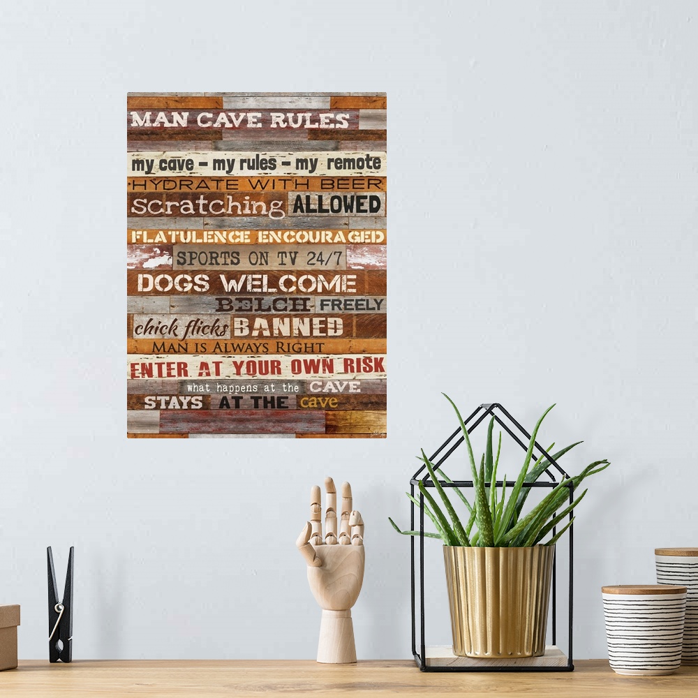 A bohemian room featuring Typography artwork of man cave rules, with text against a wooden background.