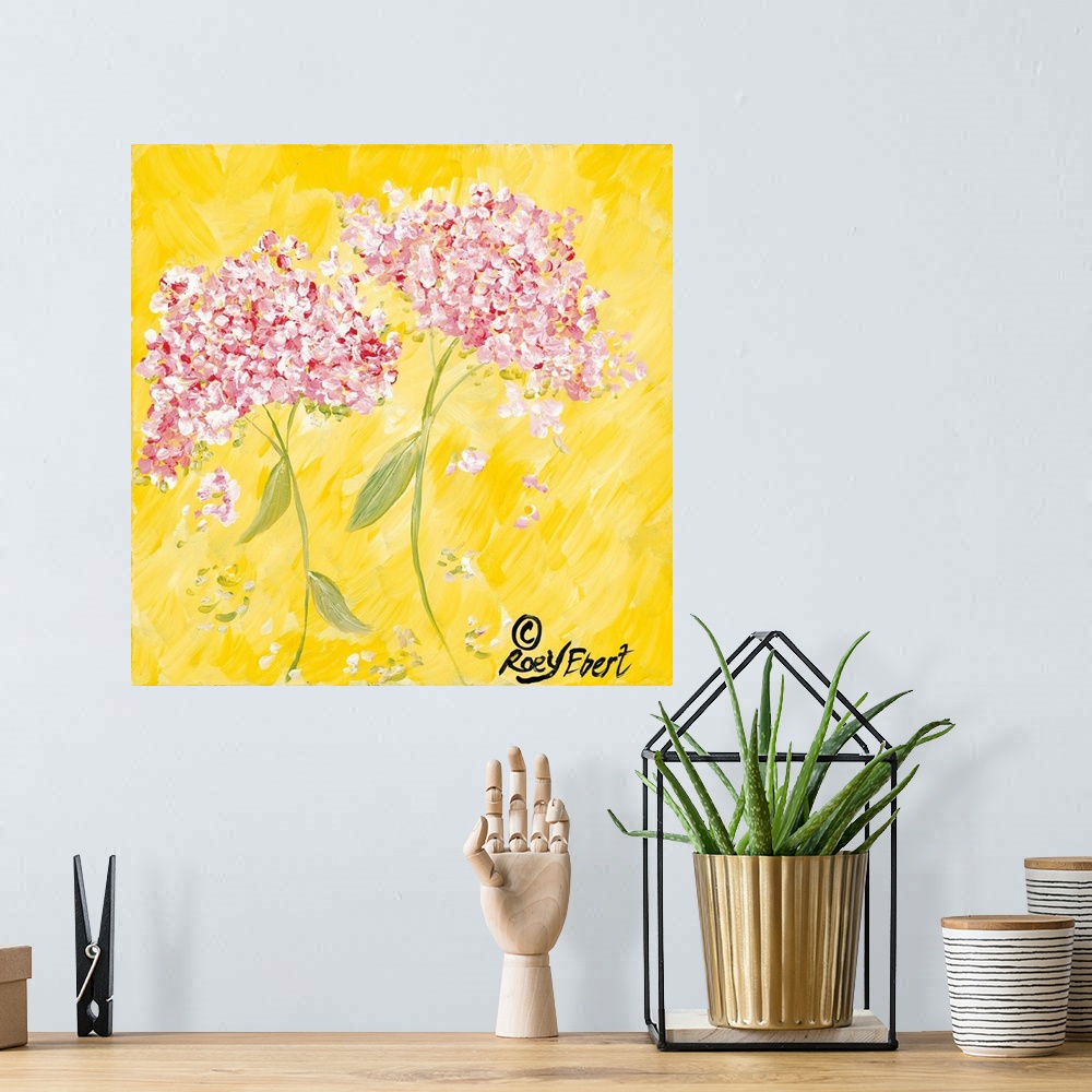 A bohemian room featuring Square contemporary painting of Pink Hydrangeas against a bright yellow background.
