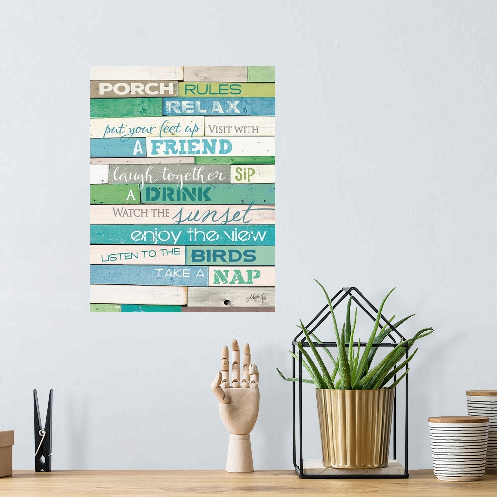 A bohemian room featuring Porch rules typography art against a rustic wooden surface.