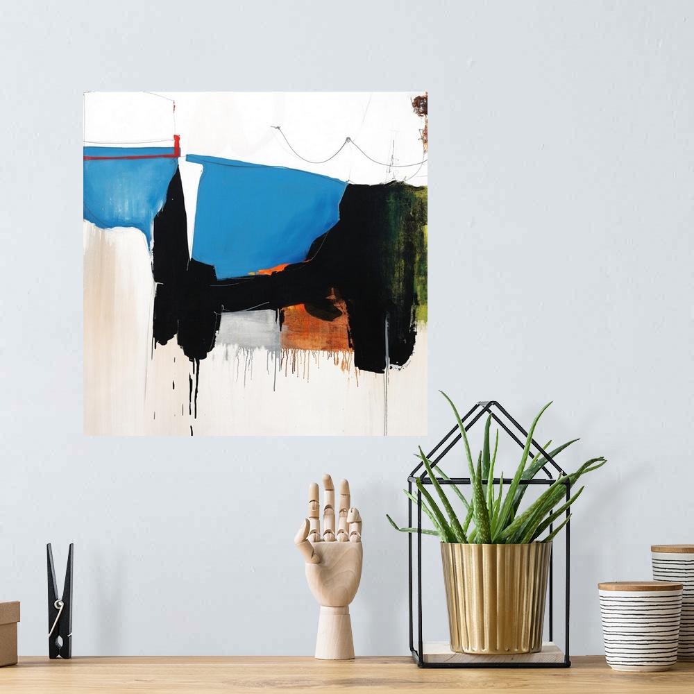 A bohemian room featuring Square abstract art with a line of connecting shapes going through the middle and falling towards...