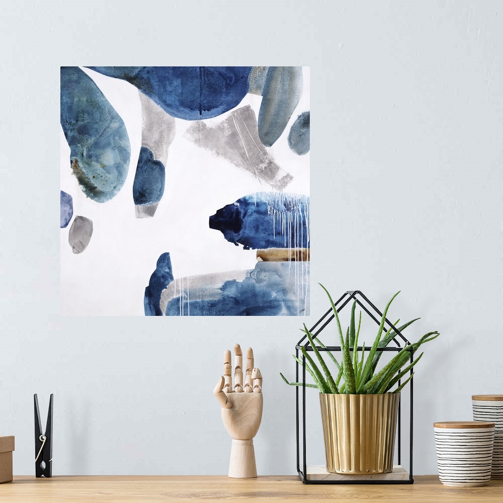 A bohemian room featuring Square painting of rounded shapes in blue with texture.