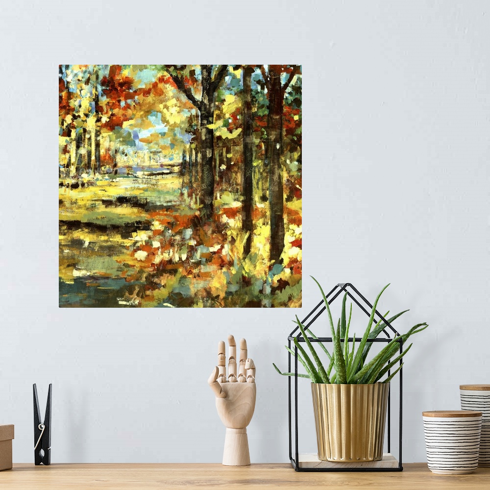 A bohemian room featuring Square painting of a fall landscape made up of fat and short brushstrokes of color.