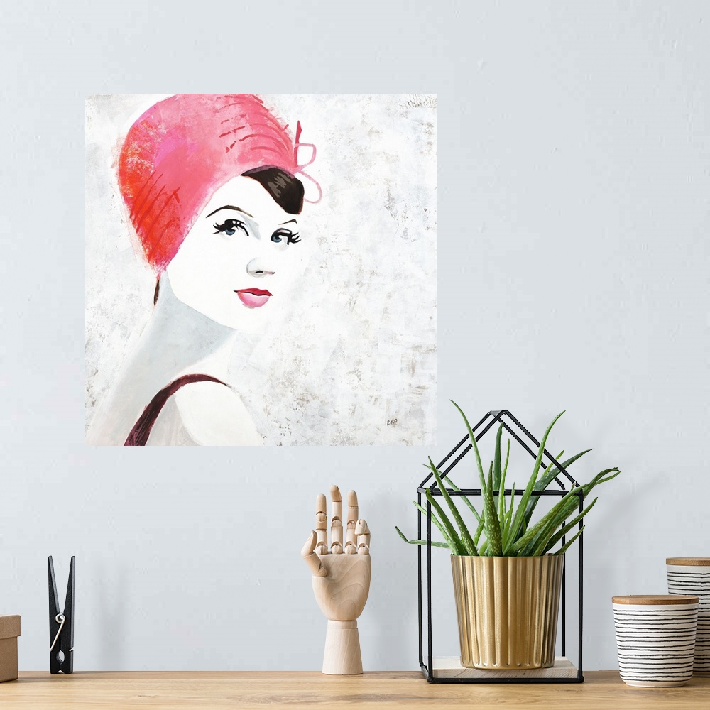 A bohemian room featuring Square painting of a woman with pink lips and a pink hat on a white background with gray and gold...