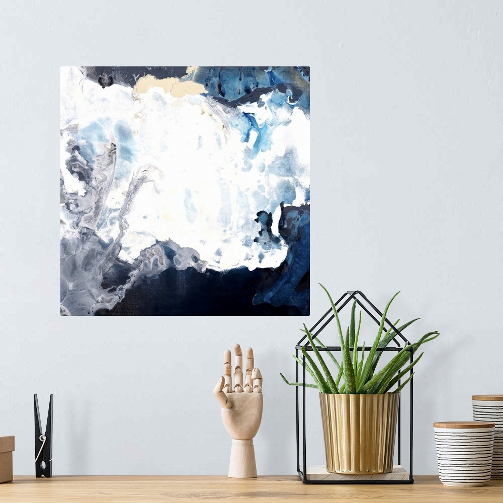 A bohemian room featuring Contemporary abstract artwork in white and dark blue resembling crashing waves.