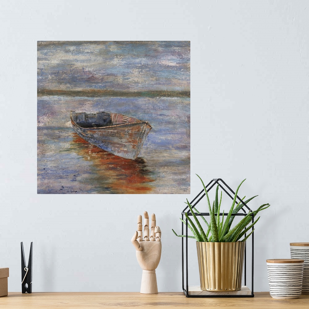 A bohemian room featuring Painting of an empty row boat sitting in calm waters at sunset, a distant mountain range can be s...