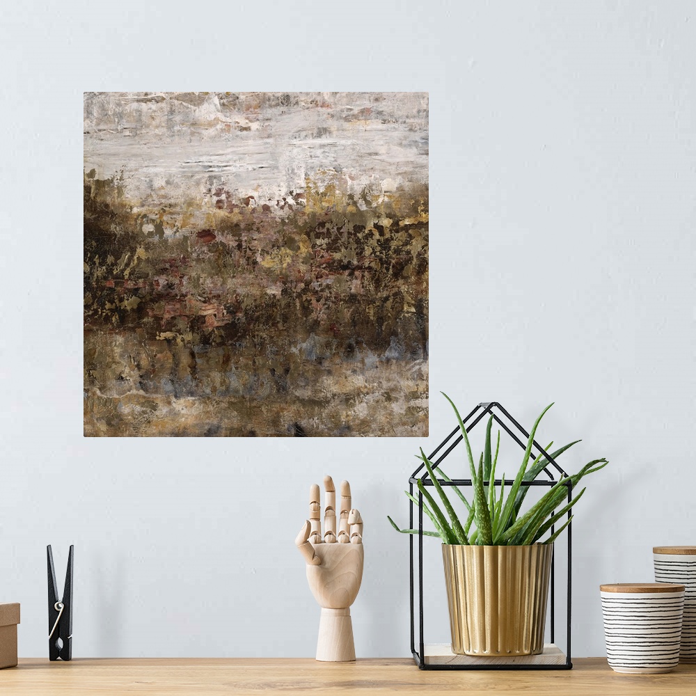 A bohemian room featuring Abstract painting of a grassy field in golden earth tones, beneath a bright cloudy sky.