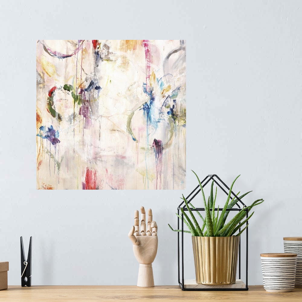 A bohemian room featuring Contemporary abstract painting in white with pops of bright colors in splatters and rings.