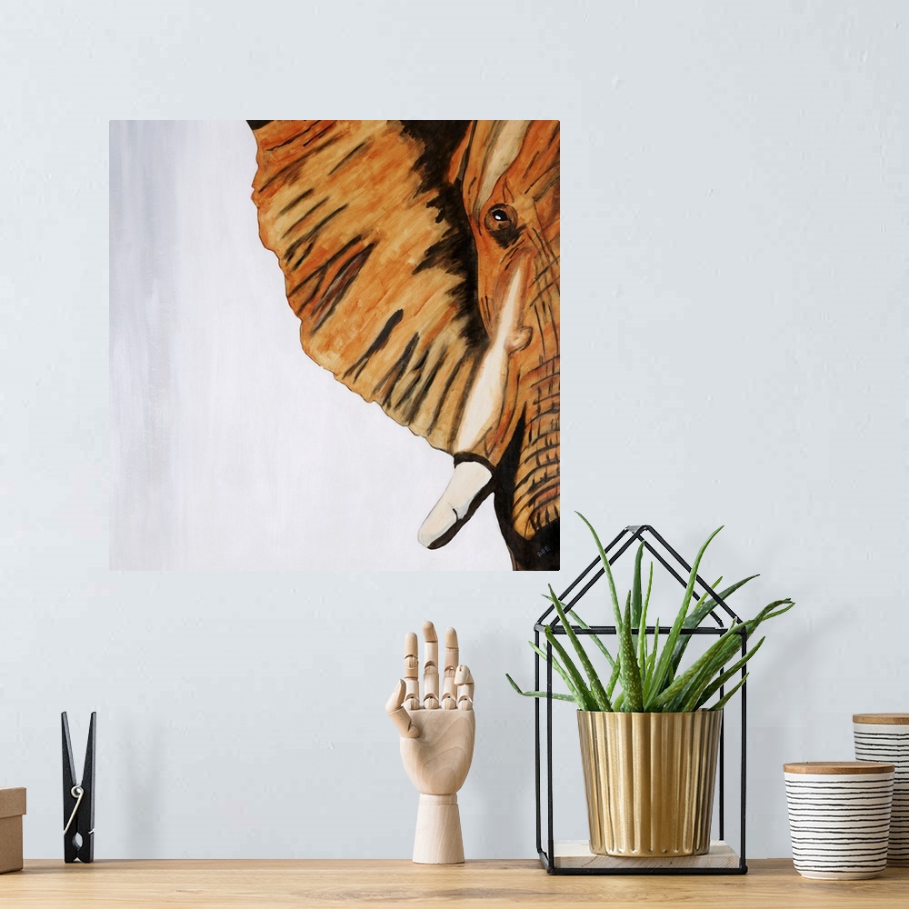 A bohemian room featuring Square abstract painting of half of an elephants face created with orange, white, gray, and black...