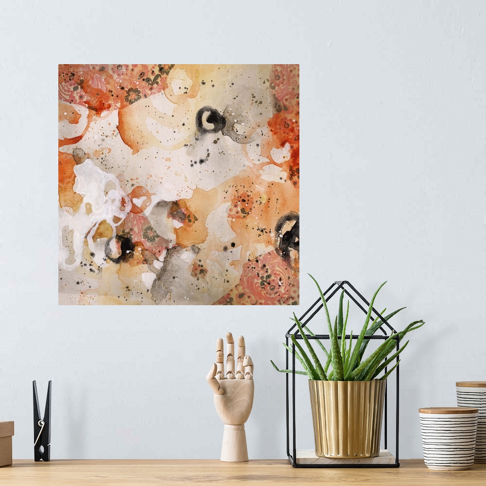 A bohemian room featuring Abstract painting using bright orange tones in splashes and splatters, almost looking like flowers.