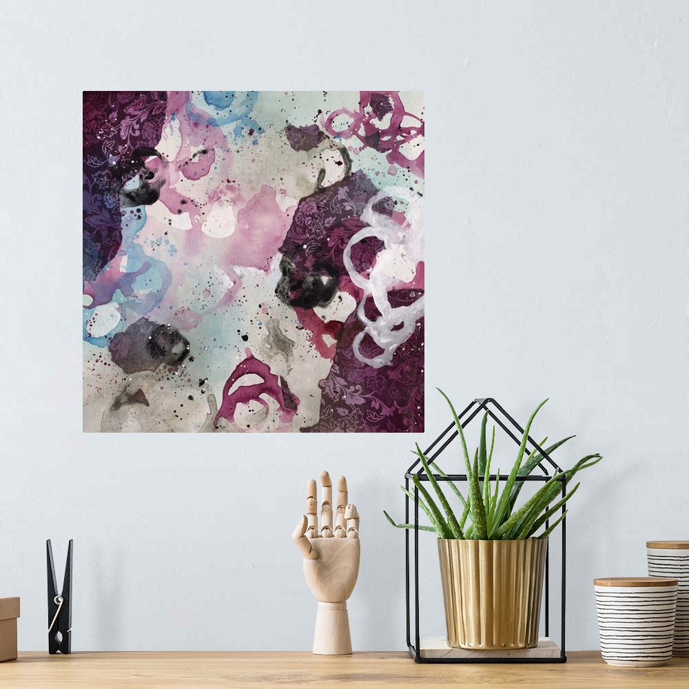 A bohemian room featuring Abstract painting using bright purple tones in splashes and splatters, almost looking like flowers.