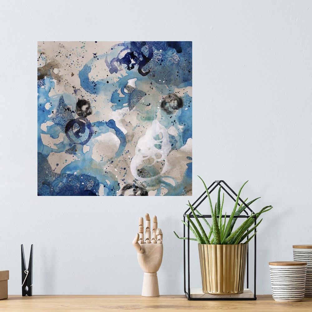 A bohemian room featuring Abstract painting using bright blue tones in splashes and splatters, almost looking like flowers.