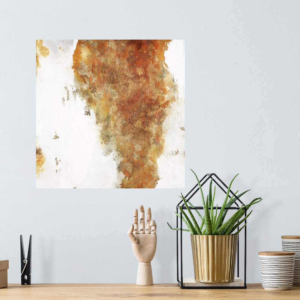 A bohemian room featuring Warm toned square painting with orange, yellow, copper, and gold on a white background with small...