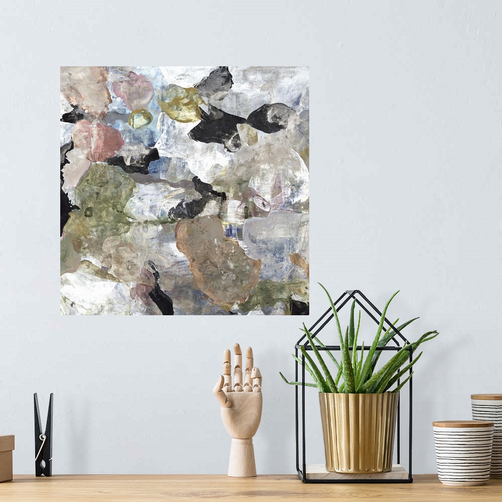 A bohemian room featuring A square abstract painting of rounded multi-colored shapes with a marbled effect.