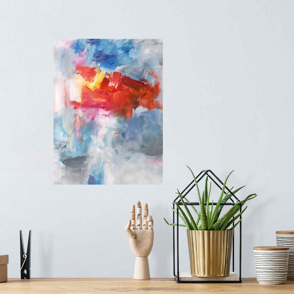 A bohemian room featuring Contemporary abstract painting using bright red tones over a mixture of blue tones over gray.