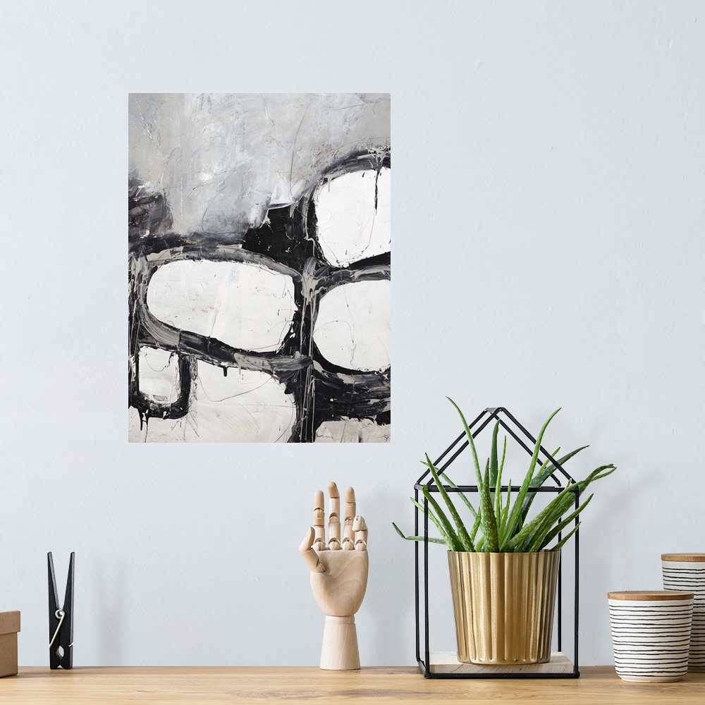 A bohemian room featuring Contemporary abstract painting in shades of black and white.