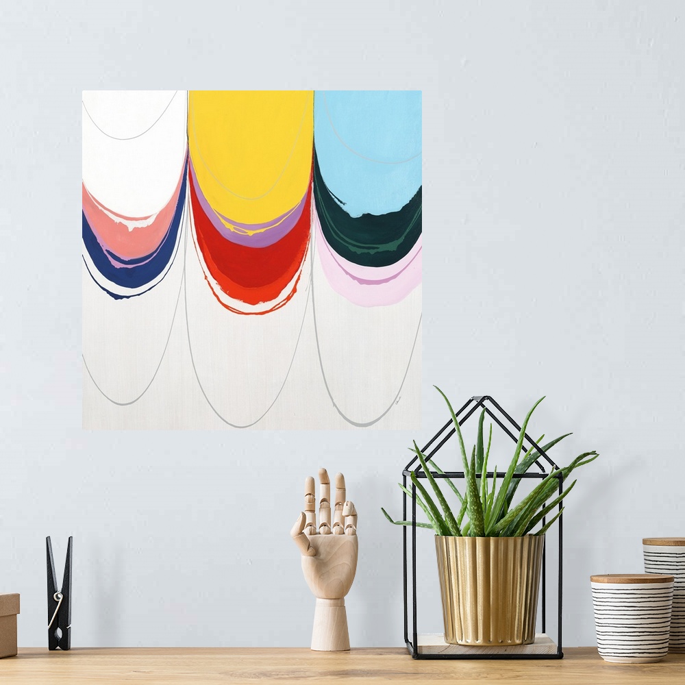 A bohemian room featuring Contemporary abstract painting using bright colors dripping from the top of the image.