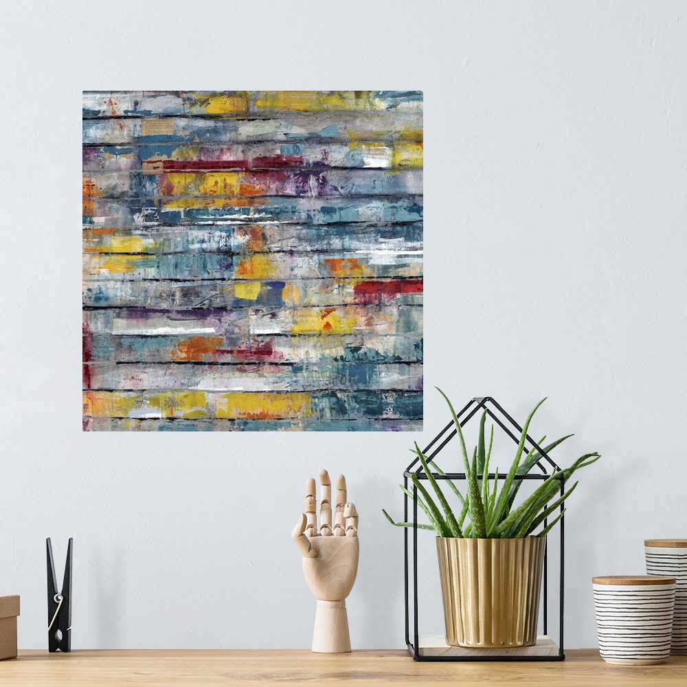 A bohemian room featuring Contemporary abstract painting of splashes of color on weathered planks.