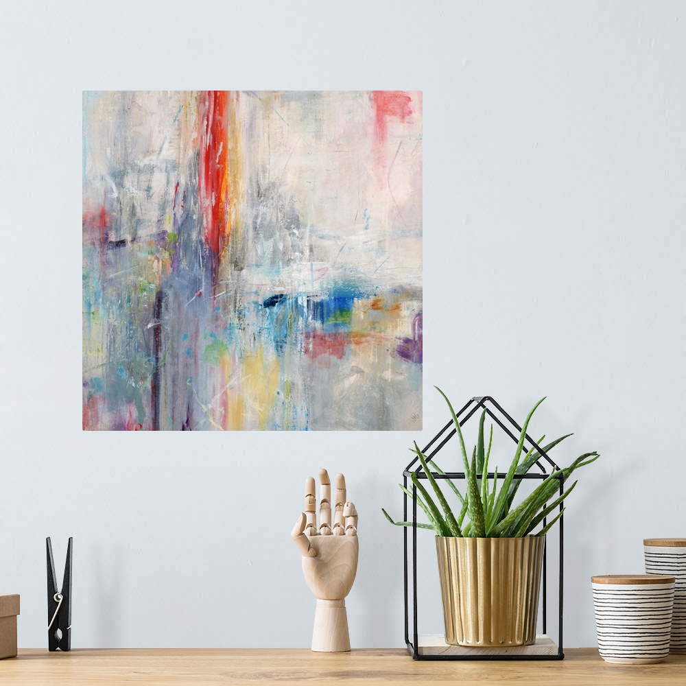 A bohemian room featuring Bright abstract contemporary painting in rainbow colors.